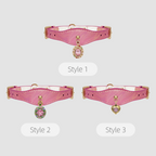 Three styles of pink chokers with heart-shaped charms on a light gray background