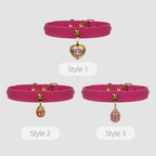 Three styles of pink dog collars with heart and teardrop charms on a light gray background.